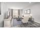 Cozy living room with neutral decor, plush seating, and large windows at 1430 Samuel St, Charlotte, NC 28206