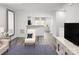 Open-concept living area featuring wood floors and ample seating space at 1430 Samuel St, Charlotte, NC 28206