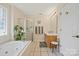 A well-lit bathroom with a separate shower, soaking tub and double vanity at 14340 Kendalton Meadow Dr, Mint Hill, NC 28227