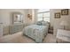 Inviting bedroom featuring a large window and traditional-style furniture at 14340 Kendalton Meadow Dr, Mint Hill, NC 28227