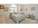 Bedroom with a vaulted ceiling, arched window and warm accents at 14340 Kendalton Meadow Dr, Mint Hill, NC 28227