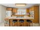 Functional kitchen featuring an island with bar seating, and light-colored cabinetry at 14340 Kendalton Meadow Dr, Mint Hill, NC 28227