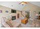Cozy living room featuring a fireplace, television, and comfortable furnishings at 14340 Kendalton Meadow Dr, Mint Hill, NC 28227