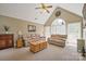 Bright living room with vaulted ceilings, plush seating, and a large arched window at 14340 Kendalton Meadow Dr, Mint Hill, NC 28227