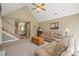 Spacious living room featuring a staircase and a comfortable seating area at 14340 Kendalton Meadow Dr, Mint Hill, NC 28227