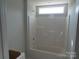 Bathroom featuring a shower and tub combination with a white surround and a small window at 149 Mason Tanner Ct, Rock Hill, SC 29730