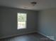 Bedroom featuring natural lighting, gray walls, white trim, and wood look flooring at 149 Mason Tanner Ct, Rock Hill, SC 29730