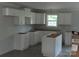View of the kitchen with white cabinets, a window, and dark countertops at 149 Mason Tanner Ct, Rock Hill, SC 29730