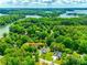 Aerial view of the lakeside property with lush green surroundings, offering privacy and tranquility at 184 Quiet Cove Rd, Mooresville, NC 28117