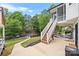 Backyard featuring stairs to a dock, a lake view, a screened porch and an outdoor structure at 184 Quiet Cove Rd, Mooresville, NC 28117