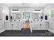 Modern bathroom with dual sinks and black fixtures with lots of space at 184 Quiet Cove Rd, Mooresville, NC 28117