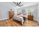 Charming bedroom features wood floors, two bedside tables, and a decorative metal design at 184 Quiet Cove Rd, Mooresville, NC 28117
