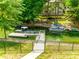 A private dock with multiple boat slips, and waterfront access, perfect for summer fun at 184 Quiet Cove Rd, Mooresville, NC 28117