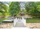 Private dock with stairs leading to the waterfront, ideal for boating and enjoying the lake at 184 Quiet Cove Rd, Mooresville, NC 28117