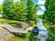 Private dock on the water with a covered boat and stairs leading from the lake at 184 Quiet Cove Rd, Mooresville, NC 28117