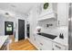 Kitchen showcasing white cabinetry, black hardware, and modern stainless appliances at 184 Quiet Cove Rd, Mooresville, NC 28117