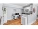 Cozy kitchenette features white cabinetry, modern appliances, and ample countertop space at 184 Quiet Cove Rd, Mooresville, NC 28117