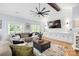 Comfortable living room with a large sectional sofa, decorative rug, and modern fixtures at 184 Quiet Cove Rd, Mooresville, NC 28117