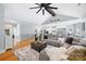 Open living space with hardwood floors and a coffered ceiling leading to an eat-in kitchen at 184 Quiet Cove Rd, Mooresville, NC 28117