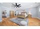 A luxurious main bedroom featuring a walk-in closet and hardwood floors at 184 Quiet Cove Rd, Mooresville, NC 28117