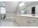 Luxurious bathroom with double vanity, soaking tub, and elegant marble tile at 19523 Sunnypoint Ct, Cornelius, NC 28031