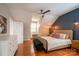 Bedroom showcasing a ceiling fan, natural light, wood floors, and neutral paint at 19523 Sunnypoint Ct, Cornelius, NC 28031