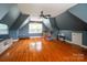 Bright bonus room with hardwood floors, exercise bike, and ample natural light at 19523 Sunnypoint Ct, Cornelius, NC 28031