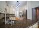 Modern kitchen featuring granite countertops, stainless steel appliances, and ample cabinet space at 19523 Sunnypoint Ct, Cornelius, NC 28031