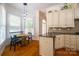 Charming kitchen nook with granite counters, stainless steel appliances and eat in breakfast area at 19523 Sunnypoint Ct, Cornelius, NC 28031