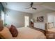 Vaulted main bedroom with wood floors, ceiling fan, ensuite access, and plenty of space at 19523 Sunnypoint Ct, Cornelius, NC 28031