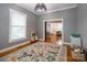 Cozy playroom features wood floors, bright light, and a neutral color palette at 19523 Sunnypoint Ct, Cornelius, NC 28031