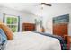 Comfortable bedroom with hardwood floors, natural light and wooden furniture at 1994 Hollybrook Ln # 17, Lancaster, SC 29720