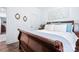Cozy bedroom features a wood sleigh bed, hardwood floors, and neutral paint at 1994 Hollybrook Ln # 17, Lancaster, SC 29720
