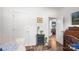 Hallway leading to the kitchen and living areas featuring wood floors and white walls at 1994 Hollybrook Ln # 17, Lancaster, SC 29720