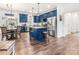 Stylish kitchen with blue cabinets, stainless steel appliances, and a central island with bar stools at 1994 Hollybrook Ln # 17, Lancaster, SC 29720