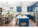 Modern kitchen featuring blue cabinets, granite countertops, stainless steel appliances, and eat in dining at 1994 Hollybrook Ln # 17, Lancaster, SC 29720