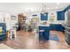 Well-designed kitchen with blue cabinets, an island with seating, and an open layout to the dining area at 1994 Hollybrook Ln # 17, Lancaster, SC 29720