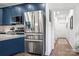 Modern kitchen features stainless steel appliances, blue cabinets, and granite counters at 1994 Hollybrook Ln # 17, Lancaster, SC 29720