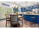 Eat in kitchen with blue cabinets, granite counters, hardwood floors, stainless steel appliances, and great lighting at 1994 Hollybrook Ln # 17, Lancaster, SC 29720
