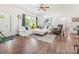 Inviting living room with wood floors, a large white sofa, and plenty of natural light at 1994 Hollybrook Ln # 17, Lancaster, SC 29720