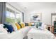 Comfortable living room featuring a white sofa with colorful pillows and a large window with a view of greenery at 1994 Hollybrook Ln # 17, Lancaster, SC 29720