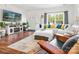 Bright living room features a fireplace, hardwood floors, and a large window at 1994 Hollybrook Ln # 17, Lancaster, SC 29720