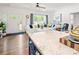 Bright open living room with hardwood floors, white sofa, and large windows that provide natural light at 1994 Hollybrook Ln # 17, Lancaster, SC 29720