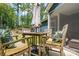 Outdoor seating area with a wooden table and chairs, ideal for entertaining guests at 1994 Hollybrook Ln # 17, Lancaster, SC 29720