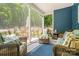 Cozy screened porch with wicker furniture, perfect for enjoying the outdoors at 1994 Hollybrook Ln # 17, Lancaster, SC 29720
