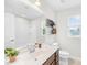Bright bathroom featuring a vanity with a white countertop, a large mirror, and a shower-tub combination at 2012 Slippery Rock Ln, Monroe, NC 28112