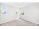 Sun-filled bedroom with multiple windows offering abundant natural light and views at 2012 Slippery Rock Ln, Monroe, NC 28112