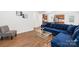 Comfortable living room with blue sofa, coffee table, and accent chair offering a welcoming and stylish interior at 2012 Slippery Rock Ln, Monroe, NC 28112