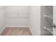 Walk-in closet with carpet and shelving at 2012 Slippery Rock Ln, Monroe, NC 28112