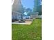 Exterior view of a home showcasing an expansive backyard with a patio, shed, and lush greenery at 2025 Kisatchie Dr, Hickory Grove, SC 29717
